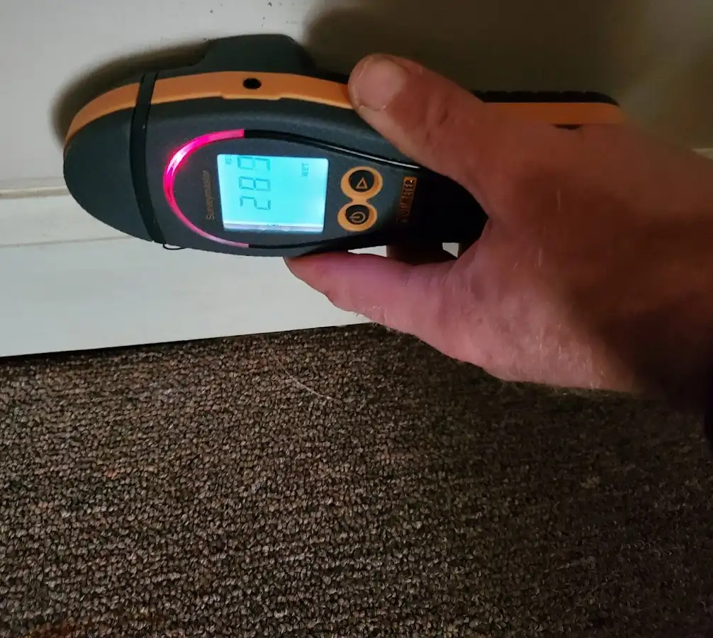 Moisture detection at baseboard during Storm Damage Restoration in Glassboro